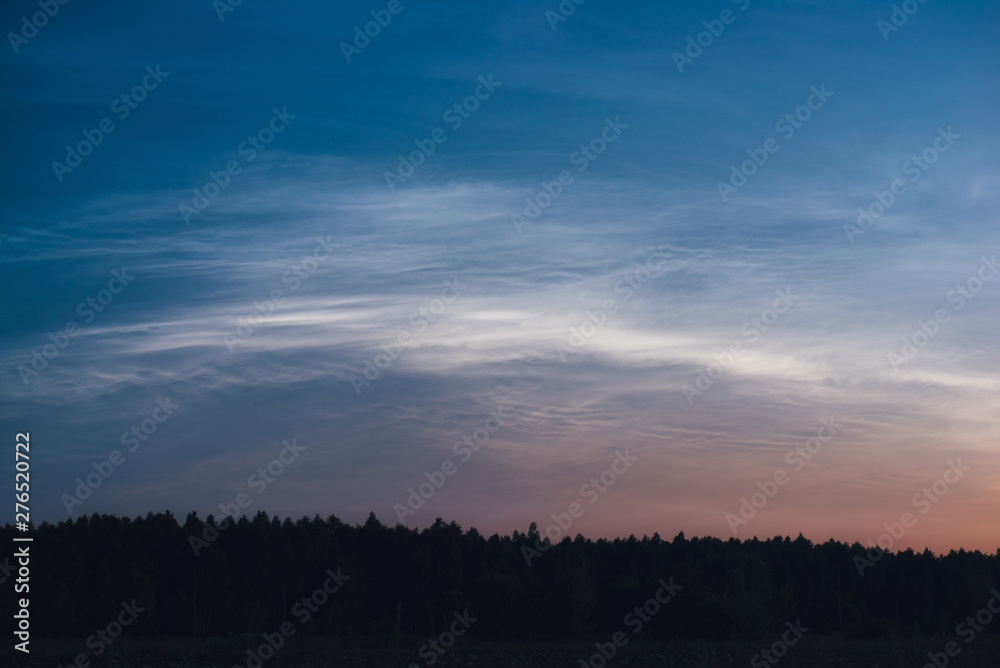 .Noctilucent clouds on a summer night close up