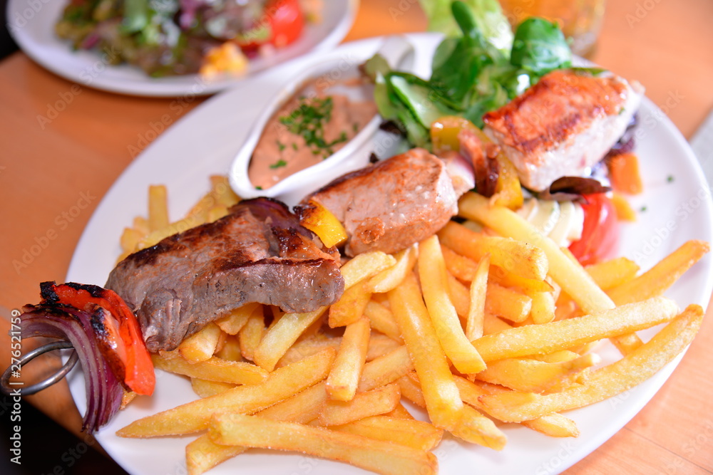 Close up of BBQ and French fries; Haydnbrau;Vienna;Austria Close up of BBQ and French fries; Haydnbrau;Vienna;Austria