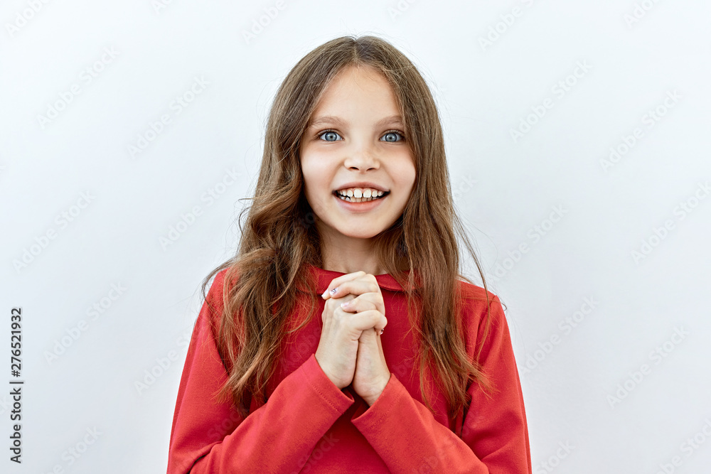 Beautiful child girl portrait against white background. Laughter and joy emotions Beautiful child girl portrait against white background. Laughter and joy emotions