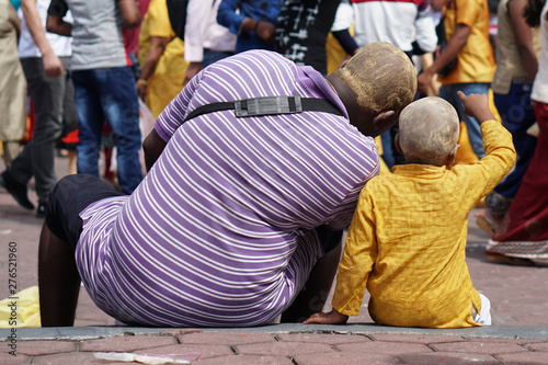 father and son at the Thaipusam in Malaysia photo