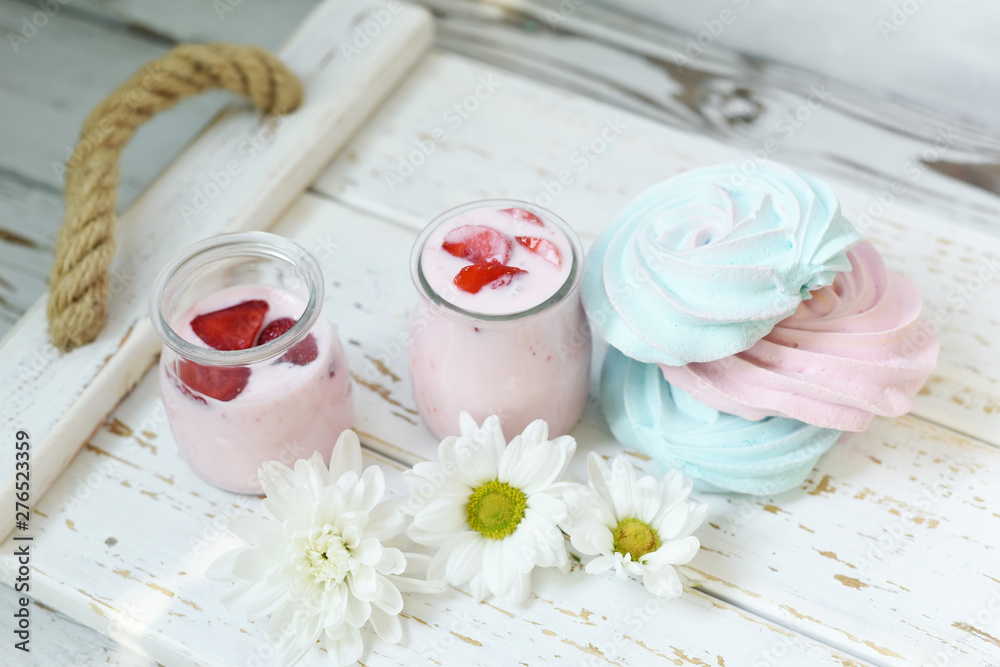 Fruit homemade yogurt and sweet cookies on a light wooden tray. The mood of summer holidays, eating on the air. Fruit homemade yogurt and sweet cookies on a light wooden tray. The mood of summer holidays, eating on the air.