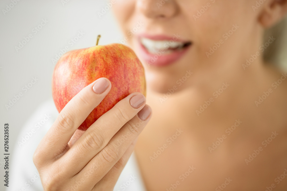food, diet and people concept - close up of woman holding ripe red apple food, diet and people concept - close up of woman holding ripe red apple