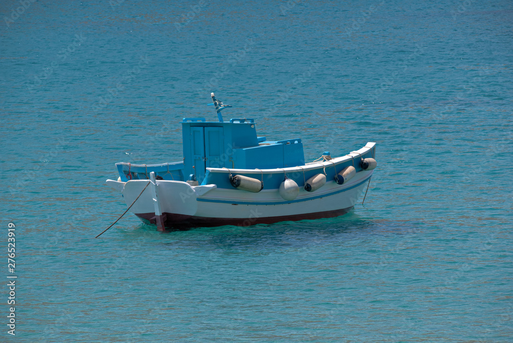 Naklejka premium small fishing boat on the sea