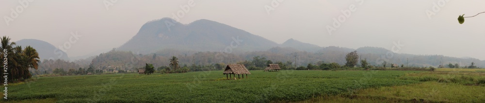 panoramic views of traditional farm land and crops spreading out into the distant mountains of Northern Thailand, Southeast Asia panoramic views of traditional farm land and crops spreading out into the distant mountains of Northern Thailand, Southeast Asia