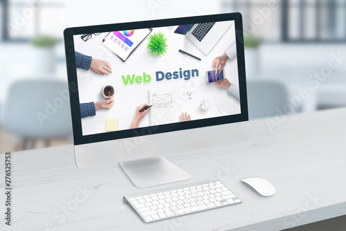 Web site design studio concept. Computer display with web design text.