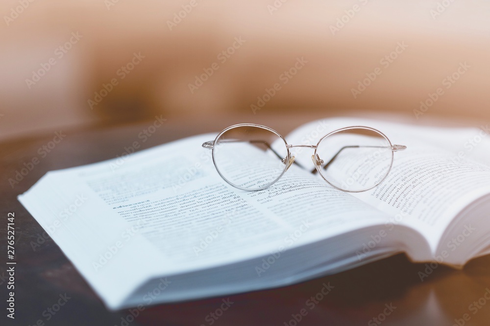 Glasses placed on textbooks in the school library Glasses placed on textbooks in the school library