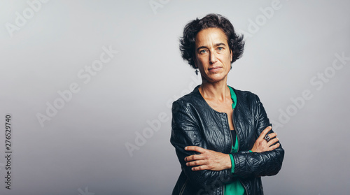 Portrait of a woman with arms crossed photo