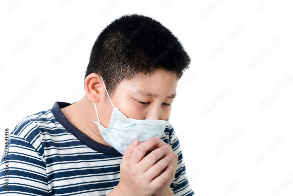 Asian sick young preteen boy with face mask on, boy coughing inside mask on white background. Asian sick young preteen boy with face mask on, boy coughing inside mask on white background.