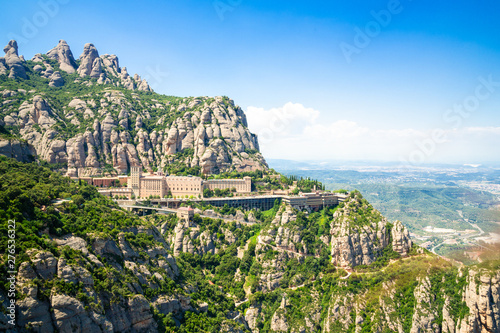 Montserrat Monastery is located on the mountain of Montserrat, Catalonia, Barcelona, Spain Sunny day, blue sky photo