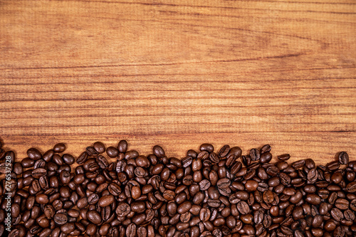 coffee beans and wood background.