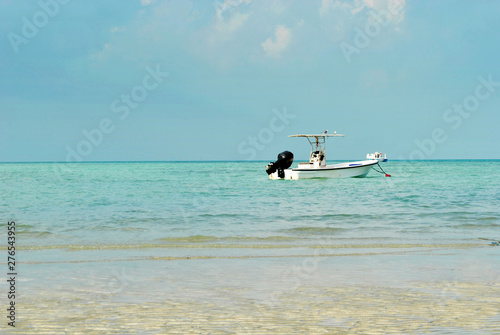 Fishing boat at the sea in sunny day