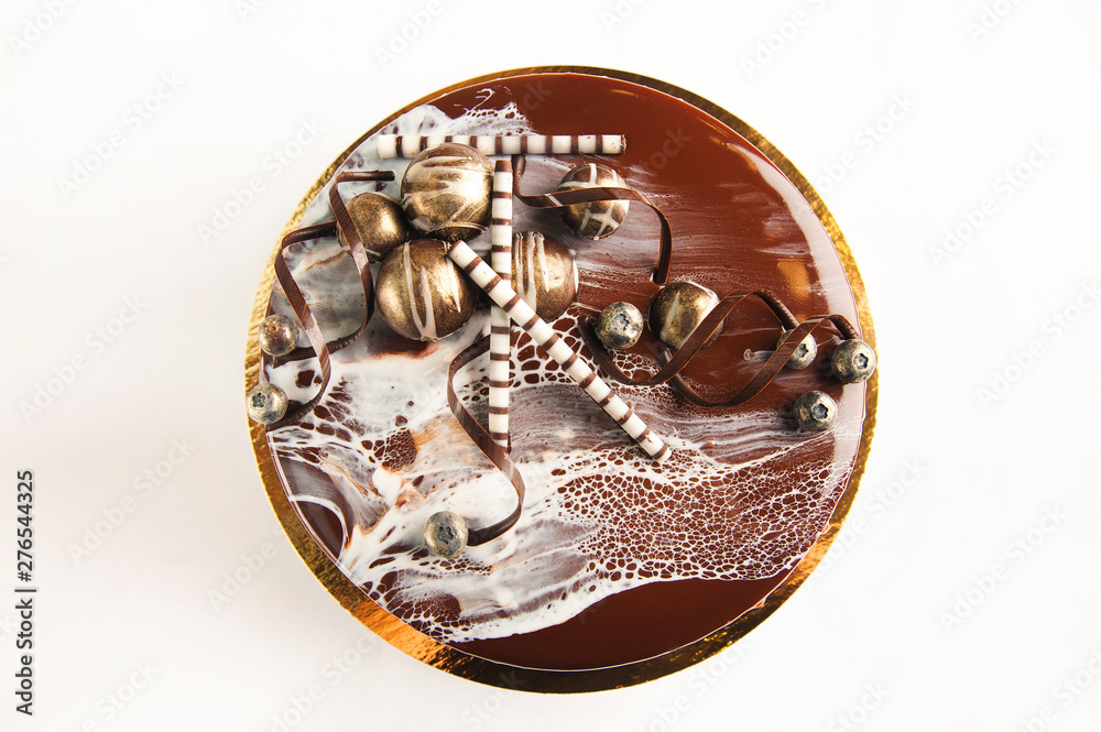 Cake with fruit, chocolate, flowers is isolated on a white background close-up and copy space. Cake with fruit, chocolate, flowers is isolated on a white background close-up and copy space.