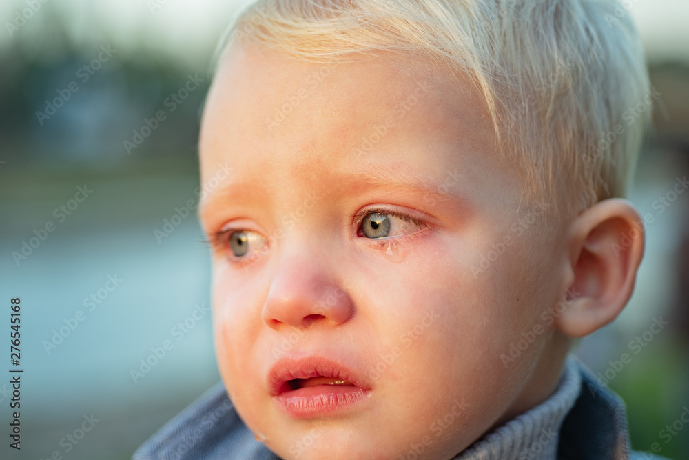 Little boy with tears close up defocused background. Emotional sad baby. Toddler sad face crying. Sad emotions. Hard to be toddler. Cute son crying face. Reasons baby crying. Tears on eyes Little boy with tears close up defocused background. Emotional sad baby. Toddler sad face crying. Sad emotions. Hard to be toddler. Cute son crying face. Reasons baby crying. Tears on eyes