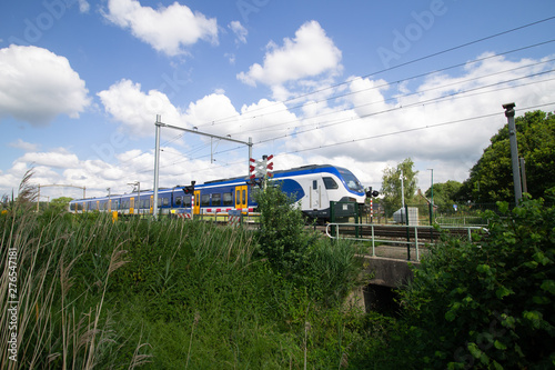 Train passing by a level crossing with high speed