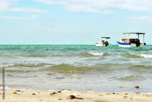Fishing boat at the sea in sunny day