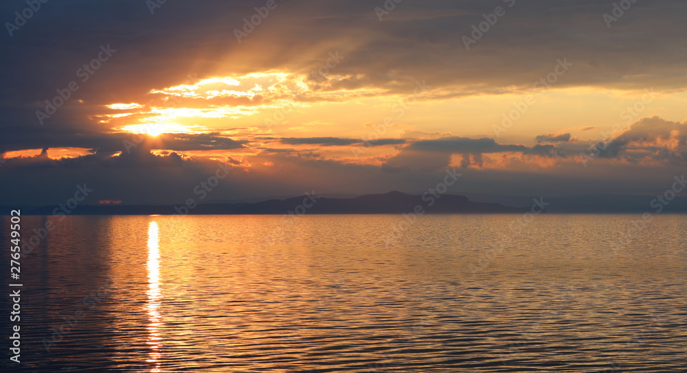 Fototapeta premium Sonnenuntergang am Meer vor der Küste Neuseeland