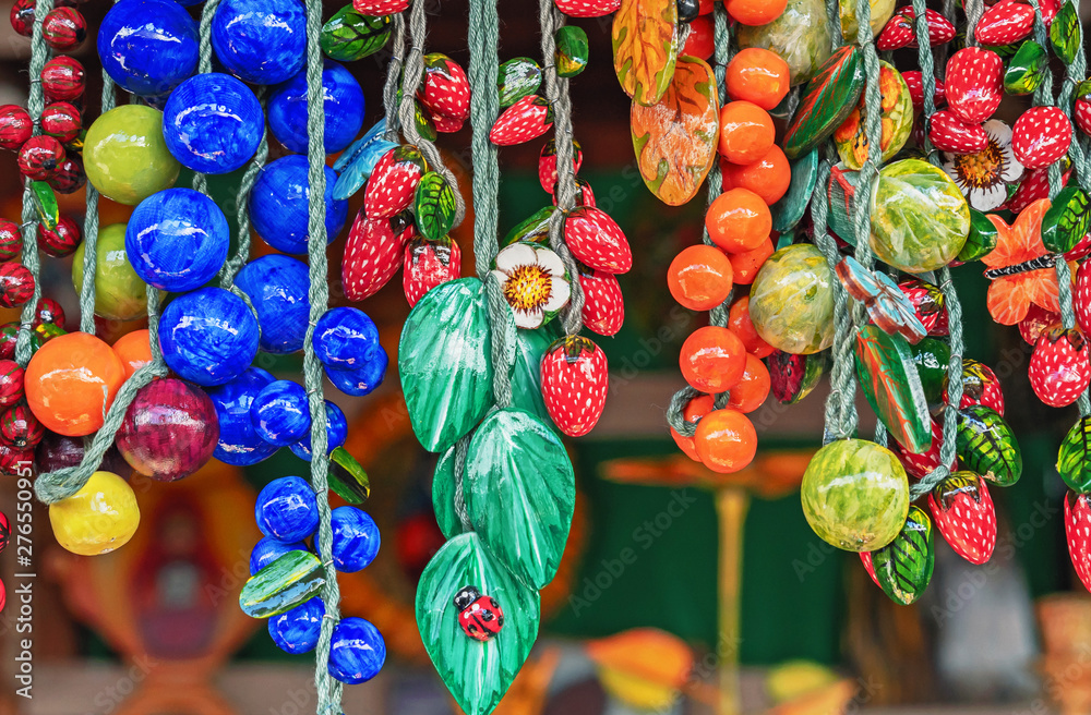 Beads in the form of bright berries for design and decoration of home interior.