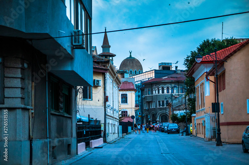 Street in old town Constanta at evening, popular tourist destination and resort on a Black Sea in Romania.
