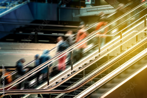 People on escalator inside  train station , travel concept blur - photo