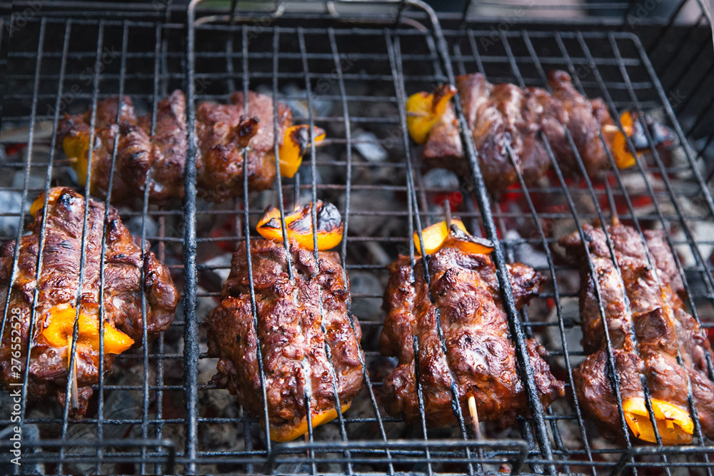 Meat on grill. BBQ. Grilled Pork Meat over the Coals on a Barbecue. Picnic Party.