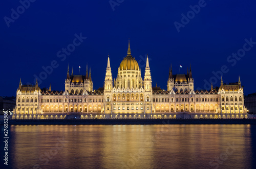 Illuminated Budapest hungarian Parliament at night reflected in the Danube river. © Dartagnan1980