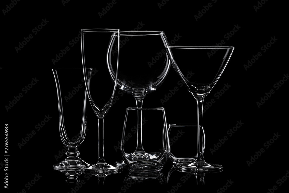 Glassware silhouettes on black.