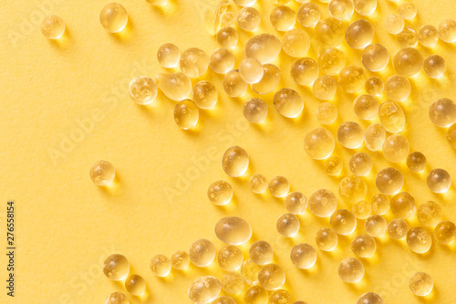 Silica gel granules over yellow background. Silicon moisture