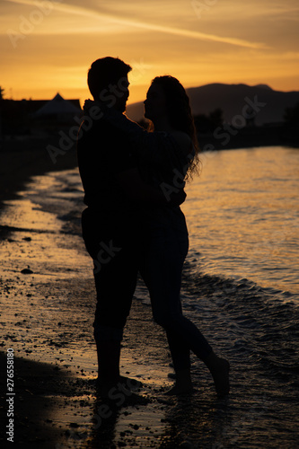 couple on the beach at sunset