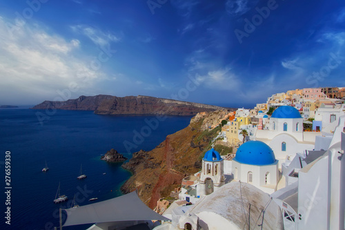 Fototapeta Naklejka Na Ścianę i Meble -  Blue and white colours of Oia City. Magnificent panorama of the island of Santorini Greece during a beautiful sunrise in the Mediterranean. Love and travel background