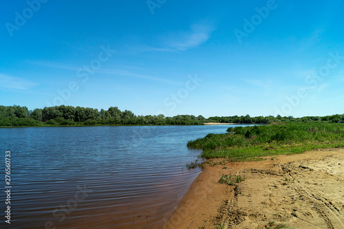 River in rural terrain at spring length of time