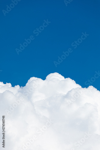 Fototapeta Naklejka Na Ścianę i Meble -  Rising storm cloud and blue sky in sunshine