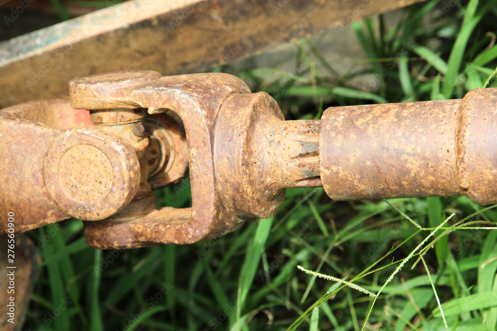 Old drive shaft, propeller shaft and universal joint of tractor. Old drive shaft, propeller shaft and universal joint of tractor.