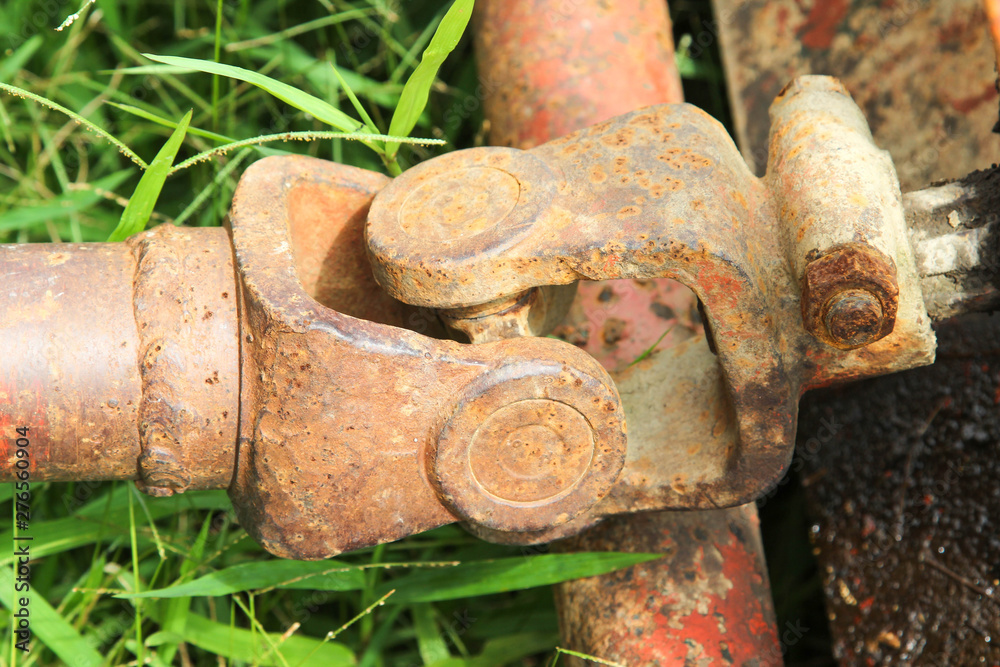 Old drive shaft, propeller shaft and universal joint of tractor. Old drive shaft, propeller shaft and universal joint of tractor.