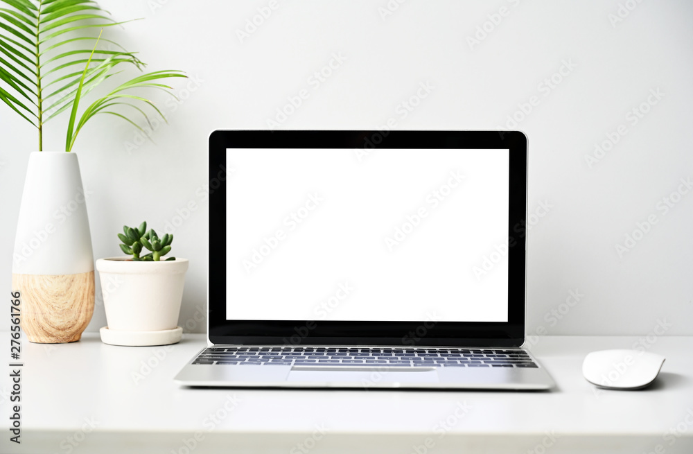 Open the laptop on office desk.front view with copy space. Open the laptop on office desk.front view with copy space.