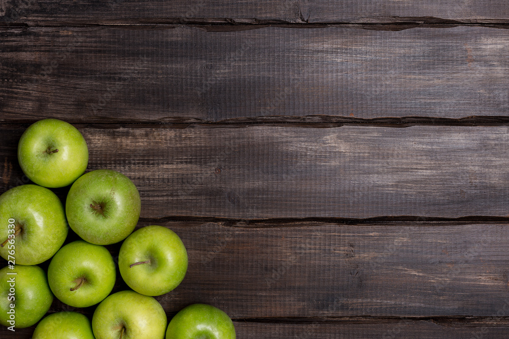 Green apples on wood background with corner Green apples on wood background with corner