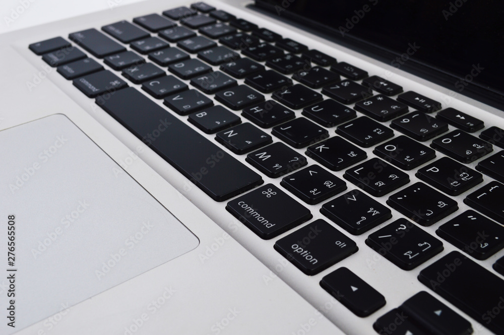 Close up laptop keyboard with Thai English language of a modern laptop Close up laptop keyboard with Thai English language of a modern laptop