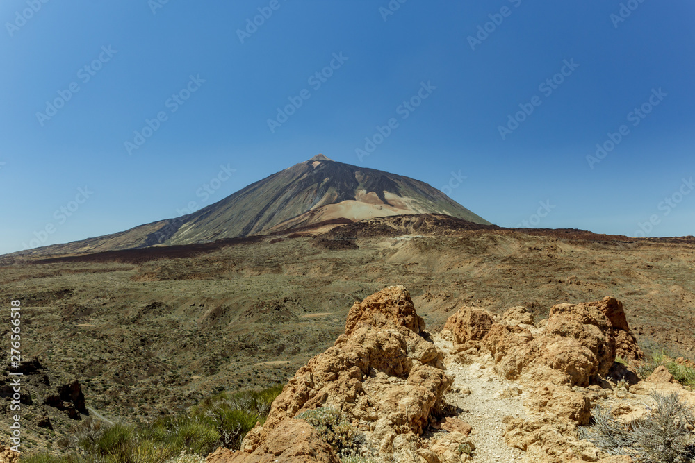 Magnificent panoramic view from the height at the edge of the mountain range around the volcano Teide. National park. Tenerife, Canary Islands, Spain