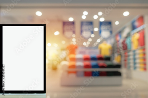 blank showcase billboard or advertising light box for your text message or media content with blurred image of popular men fashion clothes shop showcase in shopping mall, commercial, marketing concept