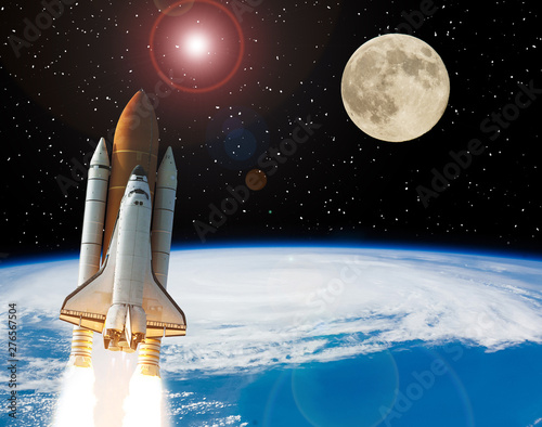 Fototapeta Naklejka Na Ścianę i Meble -  Rocket and moon. Earth on the backdrop. The elements of this image furnished by NASA.