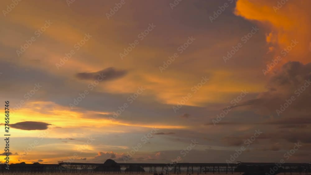 beautiful sunset behind industry pier at Kwang beach Krabi beautiful sunset behind industry pier at Kwang beach Krabi