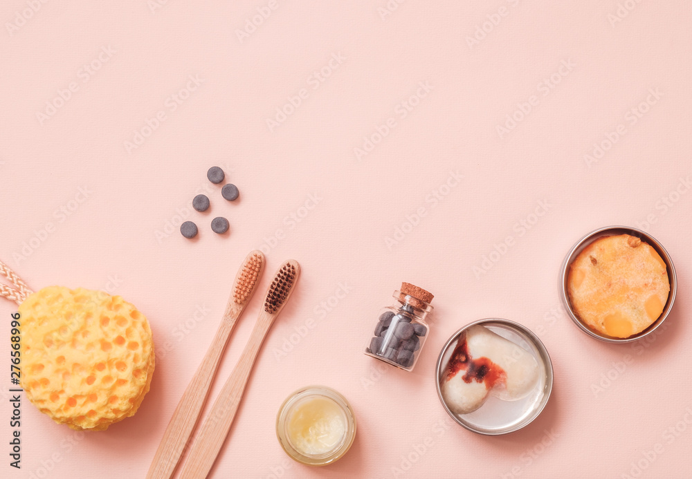 Solid Conditioner, Toothy Tabs, Bamboo Toothbrush, Natural Washing Sponge And Pressed Dry Shampoo on Light Color Table Solid Conditioner, Toothy Tabs, Bamboo Toothbrush, Natural Washing Sponge And Pressed Dry Shampoo on Light Color Table