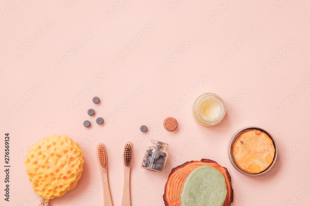 Solid Conditioner, Toothy Tabs, Bamboo Toothbrush, Natural Washing Sponge And Pressed Dry Shampoo on Light Color Table Solid Conditioner, Toothy Tabs, Bamboo Toothbrush, Natural Washing Sponge And Pressed Dry Shampoo on Light Color Table