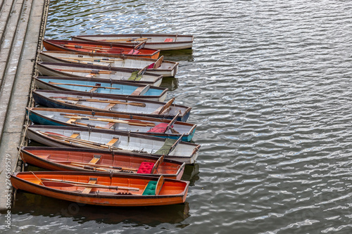 Wooden boats for hire moored on the riverside