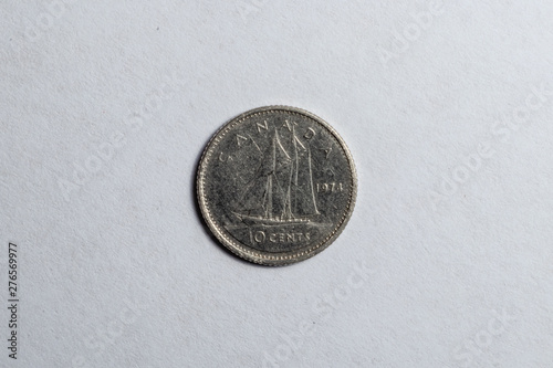 canadian dime on white background