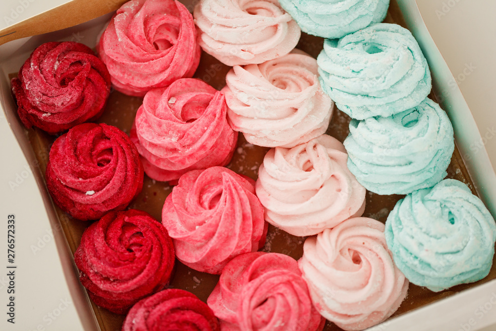 Multicolored marshmallows in paper packaging Multicolored marshmallows in paper packaging