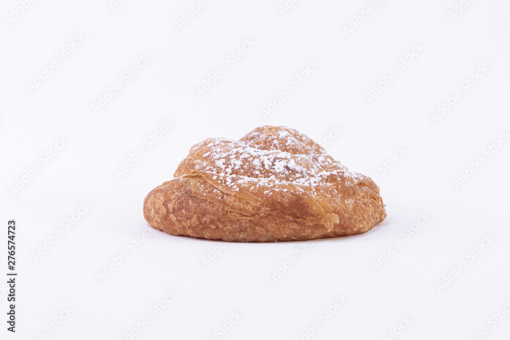 Bread made with freshly baked puff pastry dough with powdered sugar on top Bread made with freshly baked puff pastry dough with powdered sugar on top