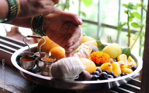 Female Worship Hands on Indian Traditional Holy Dish