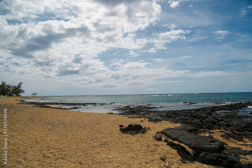 Lava beach in Hawaii with blue sky