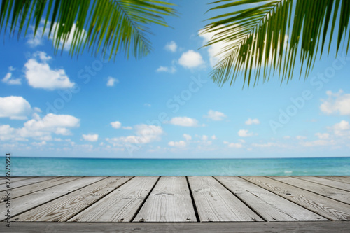 Empty wooden and tropical beach background with palm tree  summer.