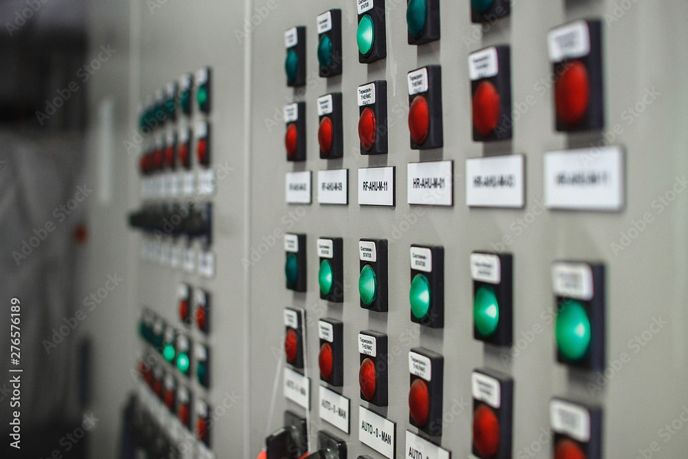 Control panel of temperature control units, selective focus. Many buttons are red and green. Control panel of temperature control units, selective focus. Many buttons are red and green.